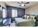 Comfortable bedroom featuring neutral tones, plush bedding and a ceiling fan at 5509 Ante Up Ct # 102, Las Vegas, NV 89122