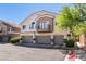 Charming townhome featuring a three-car garage, balcony, and neutral color palette at 5509 Ante Up Ct # 102, Las Vegas, NV 89122