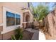 Inviting front entrance with desert landscaping and a charming walkway at 5509 Ante Up Ct # 102, Las Vegas, NV 89122