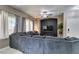 Cozy living room with large couch, ceiling fan and modern recessed lighting at 5509 Ante Up Ct # 102, Las Vegas, NV 89122