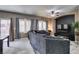Comfortable living room featuring neutral walls, large couch and bright natural light at 5509 Ante Up Ct # 102, Las Vegas, NV 89122