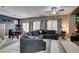 Spacious living room with a large sectional, dining area, and sliding glass doors at 5509 Ante Up Ct # 102, Las Vegas, NV 89122