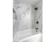 Elegant bathroom features modern marble tiling, dark fixtures, and a pristine white tub at 6 Megan Dr, Henderson, NV 89074