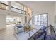 Spacious living area featuring modern decor, high ceilings, and an open staircase at 6 Megan Dr, Henderson, NV 89074