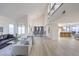 Expansive living room with an open floor plan, soaring ceilings, and contemporary furnishings at 6 Megan Dr, Henderson, NV 89074