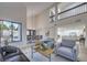 Inviting living space with high ceilings, large windows, and views of the outdoor pool area at 6 Megan Dr, Henderson, NV 89074
