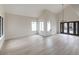 Open living room area with vaulted ceilings and door to pool area at 6 Megan Dr, Henderson, NV 89074