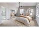 A spacious main bedroom with a mirrored closet and an attached bathroom with a glass-enclosed shower at 6 Megan Dr, Henderson, NV 89074