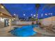 Beautiful backyard featuring a sparkling pool, jacuzzi, and comfortable lounge chairs at 6 Megan Dr, Henderson, NV 89074
