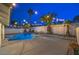 Inviting backyard with a refreshing pool, mature palms, and relaxing seating area at 6 Megan Dr, Henderson, NV 89074