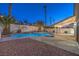 Relaxing backyard with a refreshing pool, cozy seating, and well-maintained landscaping at 6 Megan Dr, Henderson, NV 89074