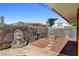 Backyard featuring a decorative fountain, gravel landscaping, and concrete pavers at 6225 Rassler Ave, Las Vegas, NV 89107