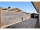 Enclosed backyard featuring a block wall, concrete, and side gate at 6225 Rassler Ave, Las Vegas, NV 89107