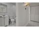 This bathroom features a tiled shower, mirror, and sink with cabinet at 6225 Rassler Ave, Las Vegas, NV 89107