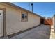 Exterior view of the house showing a side door and walkway at 6225 Rassler Ave, Las Vegas, NV 89107