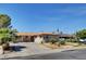 Inviting single-story home with a well-kept yard, mature trees, and a lengthy driveway at 6225 Rassler Ave, Las Vegas, NV 89107