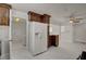 Open-concept kitchen showcasing the refrigerator, and access to additional spaces in this home at 6225 Rassler Ave, Las Vegas, NV 89107
