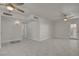Open-concept living room featuring white marble flooring, ceiling fans and backyard access at 6225 Rassler Ave, Las Vegas, NV 89107