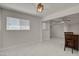 Sunlit living room features white marble floors and access to a breakfast bar at 6225 Rassler Ave, Las Vegas, NV 89107