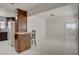 Open living space with kitchen and dining area, bright open layout, and tiled flooring at 6225 Rassler Ave, Las Vegas, NV 89107