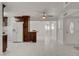 Bright and airy living space with tile floors, modern lighting, and a door to the backyard at 6225 Rassler Ave, Las Vegas, NV 89107
