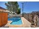 Backyard pool featuring desert landscaping and block wall fencing at 6225 Rassler Ave, Las Vegas, NV 89107