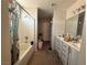 Bathroom featuring shower-tub combination, and a vanity with laminate floor at 6287 Stone Hollow Ave, Las Vegas, NV 89156