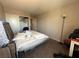 Bedroom featuring window for natural light, carpet flooring, and neutral paint at 6287 Stone Hollow Ave, Las Vegas, NV 89156