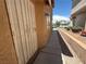Side of property with stucco exterior, secure door, and landscaped rock garden at 6287 Stone Hollow Ave, Las Vegas, NV 89156