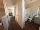 Hallway with access to the bathroom and another bedroom with neutral-toned walls at 6287 Stone Hollow Ave, Las Vegas, NV 89156