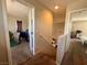 Hallway showing doors to rooms, carpeted stairs, and basic neutral-toned walls at 6287 Stone Hollow Ave, Las Vegas, NV 89156