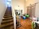 View of the open floor plan, stairs to the second floor and tile flooring at 6287 Stone Hollow Ave, Las Vegas, NV 89156
