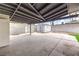 Spacious covered backyard patio featuring a shed and a concrete block wall at 6308 Lawton Ave, Las Vegas, NV 89107
