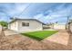 This home features a cozy backyard with artificial turf and a storage shed at 6308 Lawton Ave, Las Vegas, NV 89107