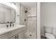 Modern bathroom features mosaic tile floor, and stylish vanity with sleek black hardware at 6308 Lawton Ave, Las Vegas, NV 89107