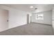Spacious bedroom featuring neutral carpet, fresh white paint, and two closets for ample storage at 6308 Lawton Ave, Las Vegas, NV 89107