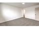 A cozy bedroom with neutral gray carpet and bright white walls, creating a serene atmosphere at 6308 Lawton Ave, Las Vegas, NV 89107