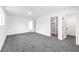 Spacious bedroom featuring neutral carpet, fresh white paint, and two closets for ample storage at 6308 Lawton Ave, Las Vegas, NV 89107