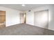 A bedroom with gray carpet, closet, and an ensuite bathroom featuring an integrated vanity at 6308 Lawton Ave, Las Vegas, NV 89107