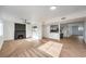 Open concept living area with fireplace and view into kitchen at 6308 Lawton Ave, Las Vegas, NV 89107