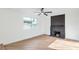Bright living room featuring a modern fireplace and light wood flooring at 6308 Lawton Ave, Las Vegas, NV 89107