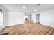 Bright living room boasts wood-look floors, fresh white paint, and ample natural light throughout at 6308 Lawton Ave, Las Vegas, NV 89107