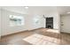 Open living area with a modern fireplace and light-filled windows at 6308 Lawton Ave, Las Vegas, NV 89107