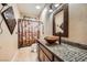 Unique bathroom design with mosaic tile countertop and copper colored fixtures and sink at 7030 Silver Ridge Peak St, Las Vegas, NV 89166