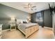 Comfortable bedroom features a ceiling fan, wood-look flooring, and gray paint at 7030 Silver Ridge Peak St, Las Vegas, NV 89166