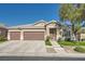 Inviting single-Gathering home featuring a spacious three-car garage and landscaped front yard at 7030 Silver Ridge Peak St, Las Vegas, NV 89166