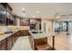 Gourmet kitchen with granite countertops, stainless steel appliances, and a center island at 7030 Silver Ridge Peak St, Las Vegas, NV 89166