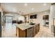 Spacious kitchen featuring granite countertops, stainless steel appliances, and open floor plan at 7030 Silver Ridge Peak St, Las Vegas, NV 89166