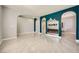 Spacious living area with modern wood floors, fireplace, and elegant archways at 7030 Silver Ridge Peak St, Las Vegas, NV 89166