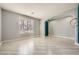 Bright living room with light wood floors, plantation shutters, and a stylish archway at 7030 Silver Ridge Peak St, Las Vegas, NV 89166